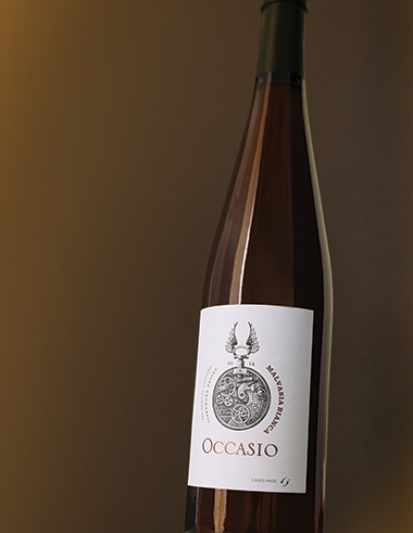 bottle of malvasia bianca with brown background