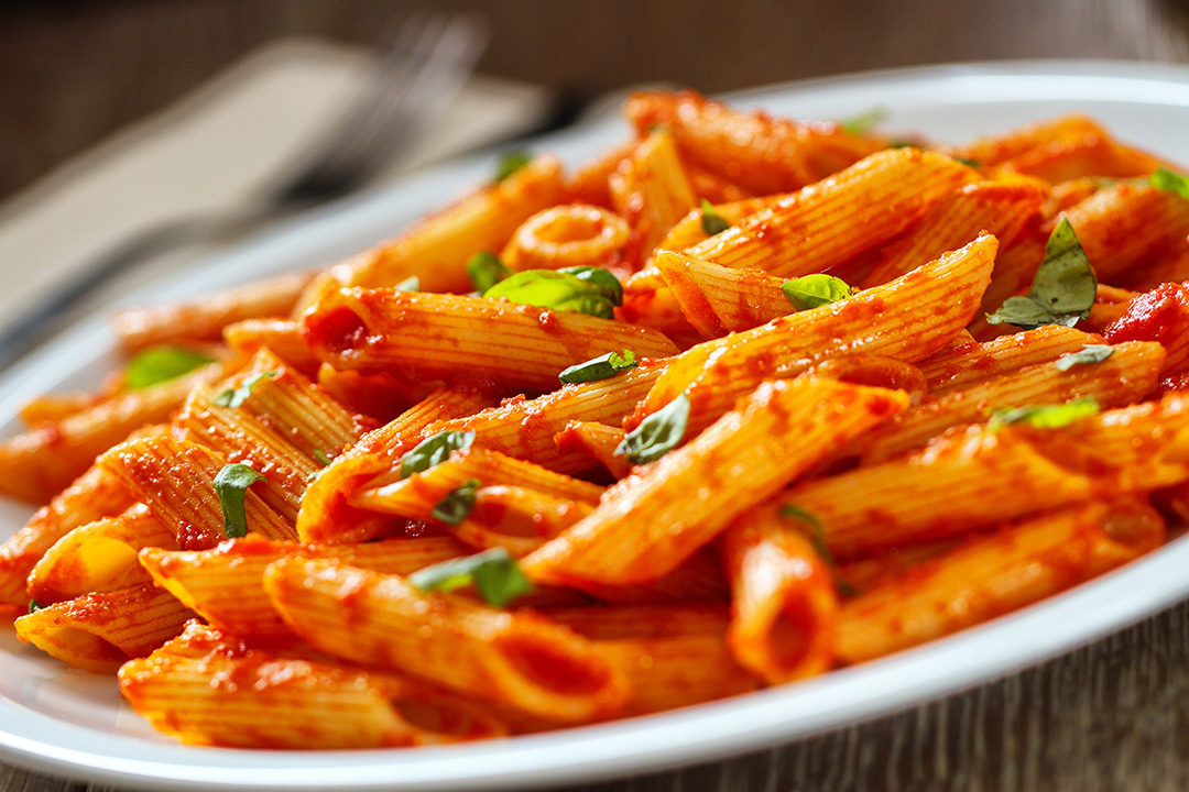 a decorative picture open pasta in a tomato sauce