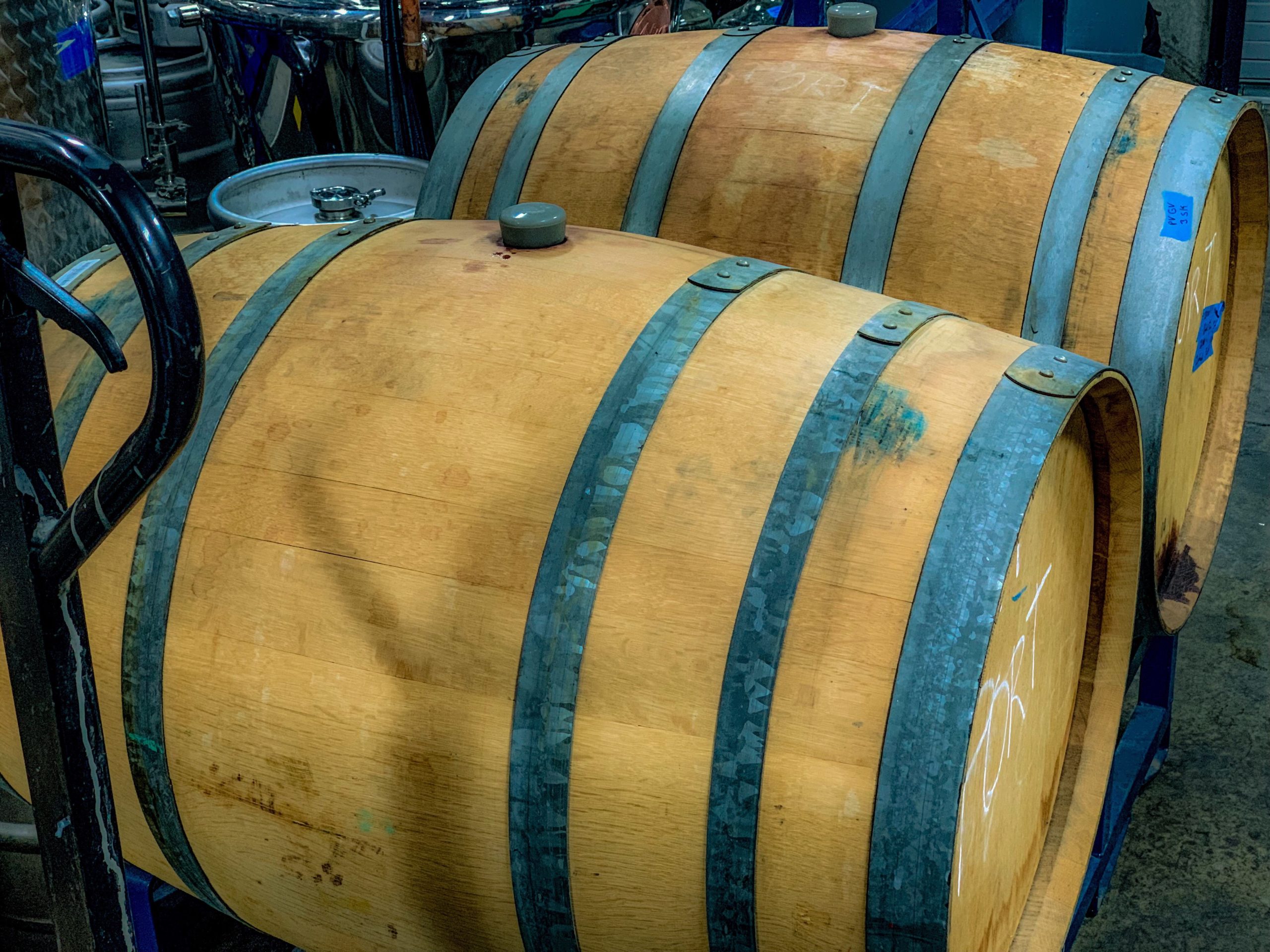 A picture of two oak barrels filled with our port wine showing therm getting ready for bottling