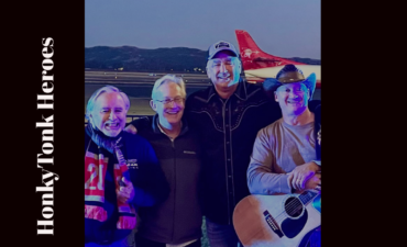 honkytonk heroes band in front of an airplane